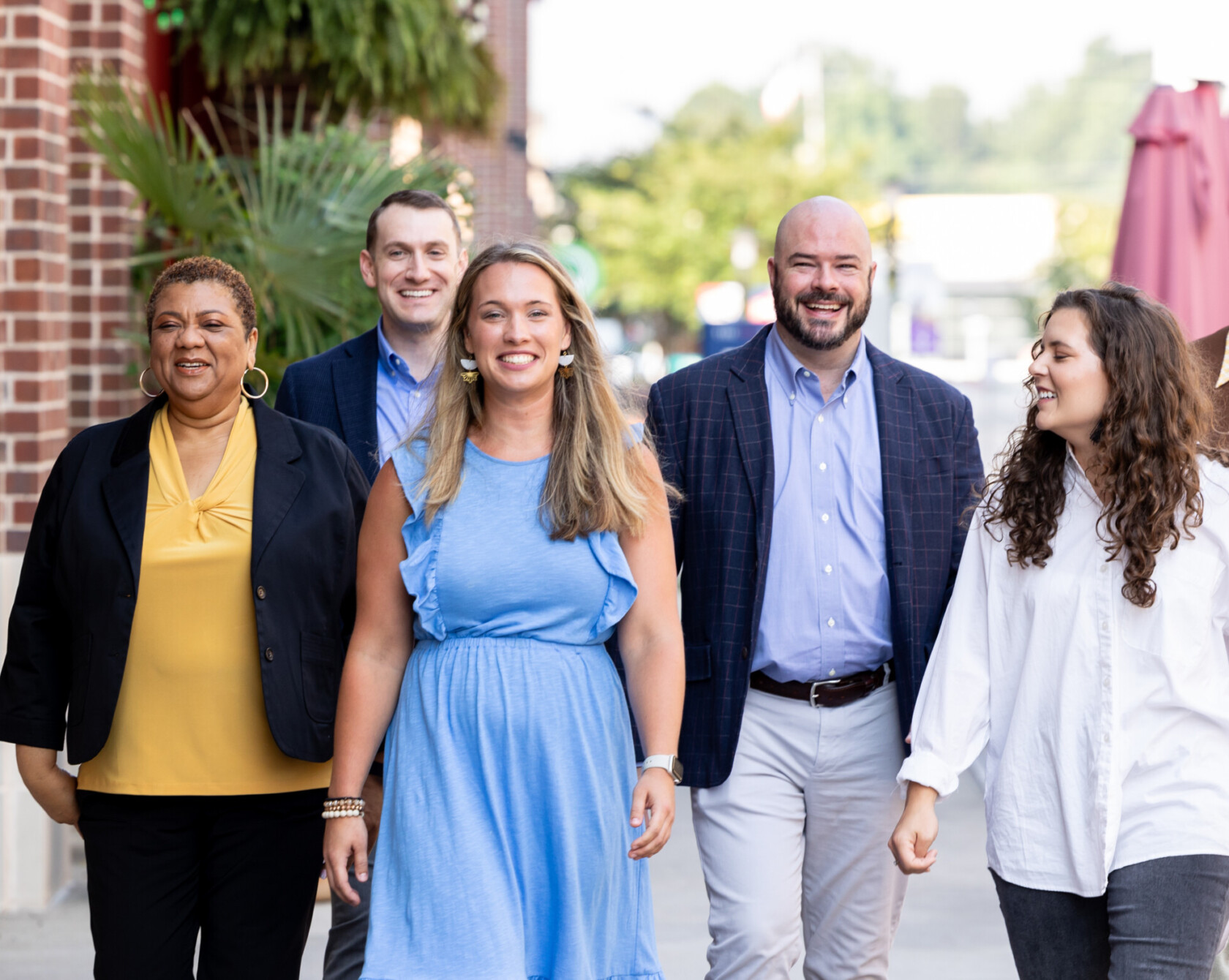 Group of ivision employees walking to the office.